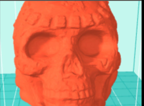 Red skull-like object on a light blue grid background